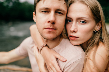 Fototapeta premium Lifestyle loving couple hugging at nature