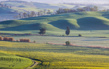 sunrise and fog over the hills in Tuscany