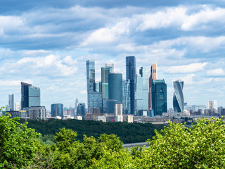 Fototapeta premium skyscrapers of Moscow-city under dark blue clouds
