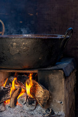 Traditional Brazilian food being prepared on old and popular wood stove