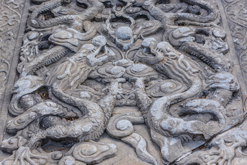 Carved stone dragons in Temple of Confucius in Beijing, capital city of China