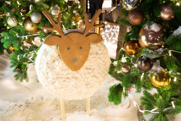 Wooden ship decoration under the Christmas tree. Winter holiday season decoration