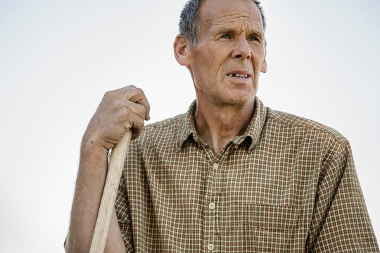 Portrait of mature farmer in gingham shirt