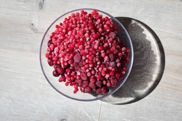 red frozen berries. Cherry covered with ice