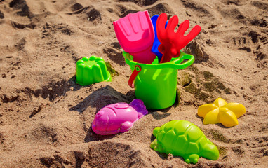 Sand bucket and shovels on sand. Children's games. Sand games.