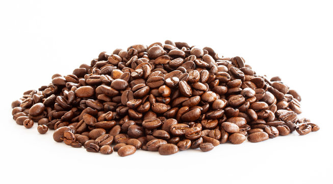 Pile of coffee beans on white background. Close up image.