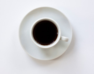 Cup of espresso coffee with saucer on white background. Top view. Close up image.
