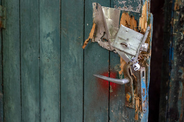 old door with a broken lock