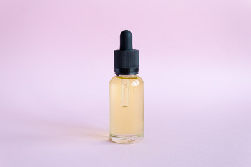 Oil cosmetics for skin care. Dropper glass Bottle makeup. Oil skin care concept