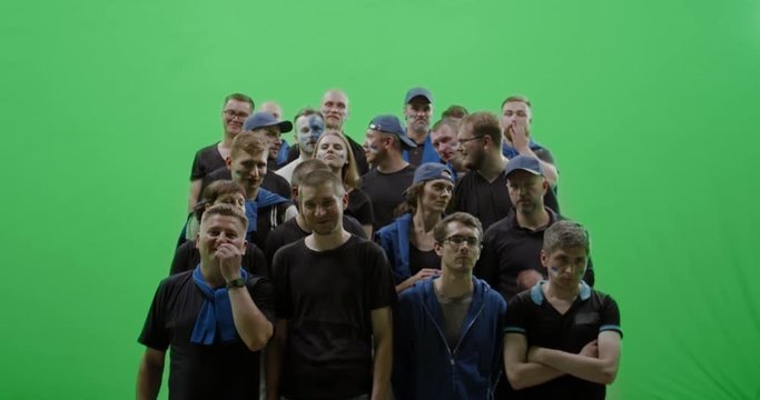 GREEN SCREEN CHROMA KEY Front view group of people fans wearing blue clothes watching a sport event. 4K UHD ProRes 422 HQ