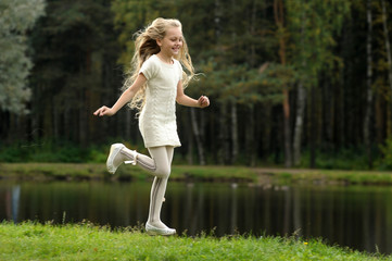 happy long-haired child girl running