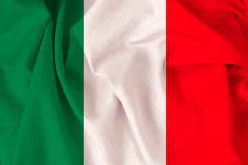 Obraz premium beautiful national flag of Italy on soft silk with soft folds, close-up, copy space