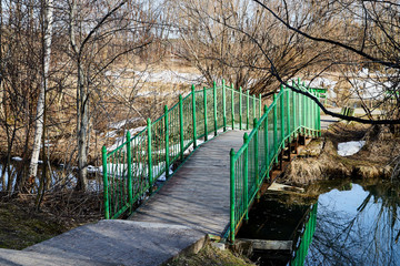 Bridge over small river in a nice sunny day in early spring