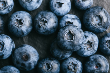 Fresh blueberry background. Texture blueberry berries close up. Vegan and vegetarian concept.