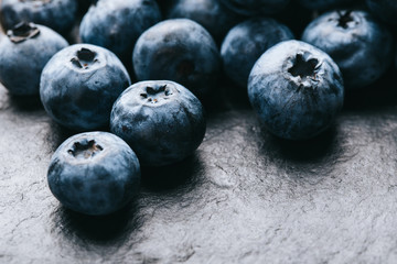 Fresh blueberry background. Texture blueberry berries close up. Vegan and vegetarian concept.