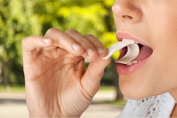 Close up on a beautiful girl while enjoying  gum