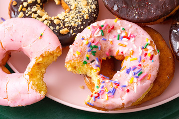 Pink donuts with a bite