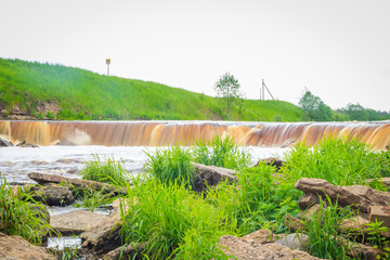 Sablinsky waterfalls. Little waterfall. The brown water of the waterfall.. Thresholds on the river....