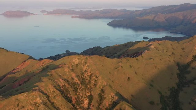 Late afternoon light illuminates the scenic island of Gili Banta, just outside of Komodo National Park, Indonesia. This tropical area is known for its marine biodiversity.