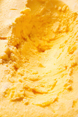 top view box of mango flavor ice cream with some digged out
