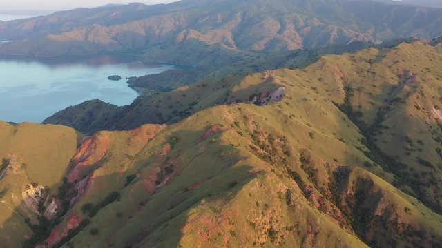 Late afternoon light illuminates the scenic island of Gili Banta, just outside of Komodo National Park, Indonesia. This tropical area is known for its marine biodiversity.