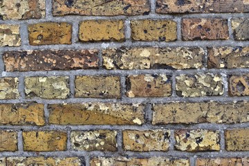 Colorful close up view on old aged and weathered brick walls in high resolution