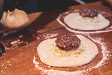 Process of cooking and serving traditional georgian food cuisine, with pkhali khinkali dumplings and khachapuri