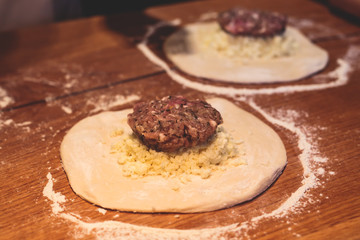 Process of cooking and serving traditional georgian food cuisine, with pkhali khinkali dumplings and khachapuri