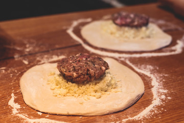 Process of cooking and serving traditional georgian food cuisine, with pkhali khinkali dumplings and khachapuri