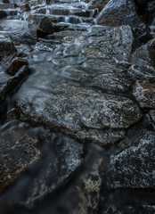 Waterfall Runs Through Trail Stepping Stones