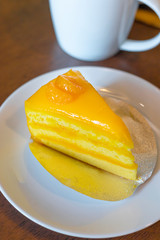 Orange Cake on white dish.