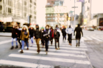 Blurry abstract background image of people walking on busy street