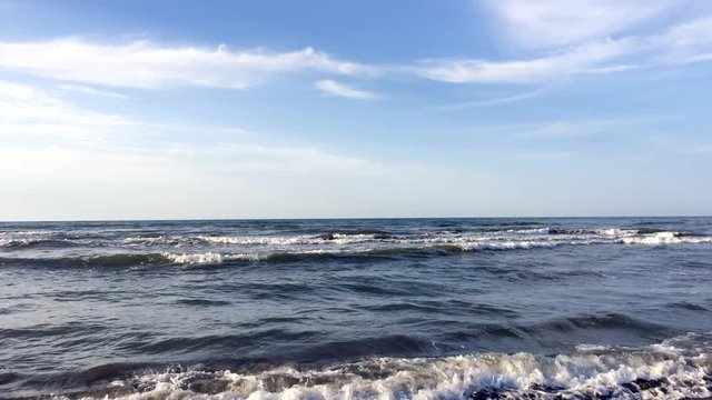 Caspian beach sea waves scene. Beside the Caspian coast on a sunny day.
