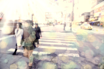 Blurry abstract background image of people walking on busy street