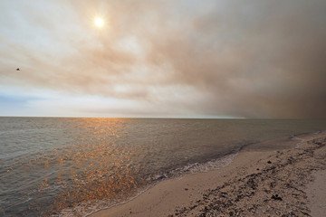 Smoke from a wildfire over the beach and Gulf of Mexico on East Cape Sable in Everglades National Park, Florida.