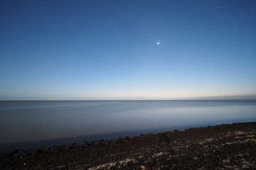 Venus and stars over the Gulf of Mexico off East Cape Sable in Everglades National Park, Florida in the light of the full moon.