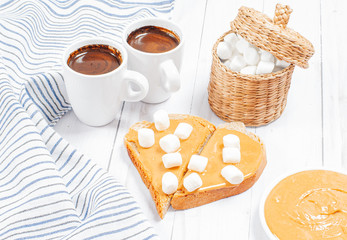 Peanut butter sandwiches. Breakfast, coffee and bread with peanut butter