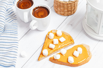 Peanut butter sandwiches. Breakfast, coffee and bread with peanut butter