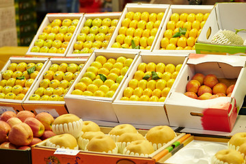 Tangerines in bucket at fruit shop