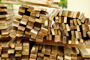 Piled up wooden planks bundles 