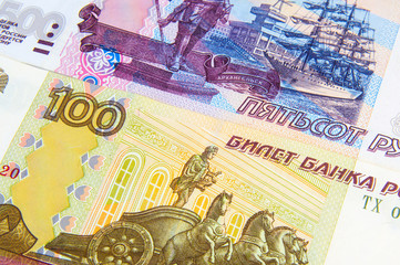 Money. Russian rubles. Notes in denominations of one hundred and five hundred rubles of the Russian Federation. Cash. Background texture. Rub. Close up. Macro shooting.