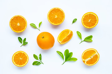 Fototapeta na wymiar High vitamin C, Juicy and sweet. Fresh orange fruit with green leaves on white