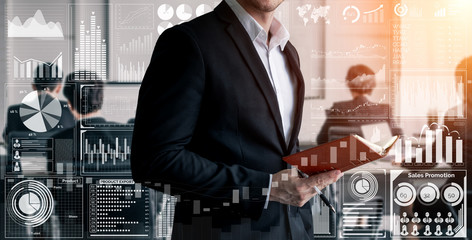 Big Data Technology for Business Finance Analytic Concept. Modern graphic interface shows massive information of business sale report, profit chart and stock market trends analysis on screen monitor.