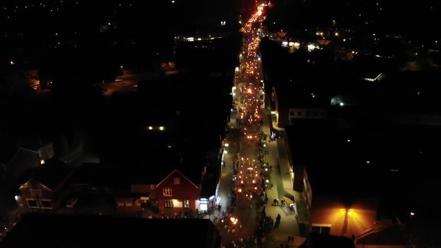Bonfire Night (Guy Fawkes Night, 5th November) street parade through Sussex, England. Traditional UK firework night festivities. 4K Drone footage.