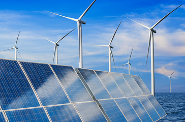 Solar energy panel photovoltaic cell and wind turbine farm power generator in nature landscape for...
