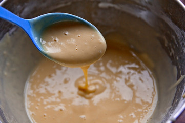  pancake dough and blue spoon