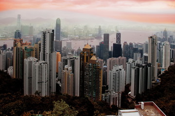 City scape in the evening.View of Hong Kong skyline in the evening.Aerial view of Hong Kong & Kowloon at night with city skyline of crowded skyscrapers by Victoria Harbour.