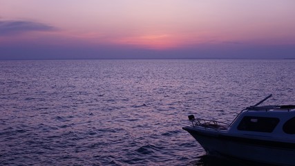 Fototapeta premium Boat on the beach at sunset in the afternoon