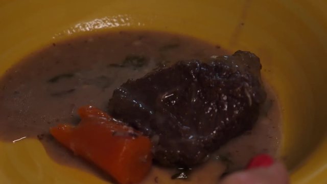 Beef bourguignon, putting the meat on the fried onions