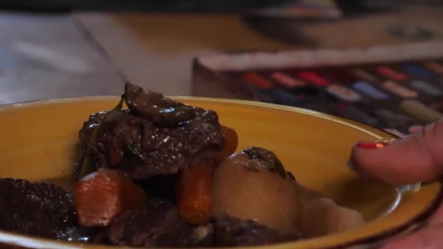 Beef bourguignon, putting the meat on the fried onions